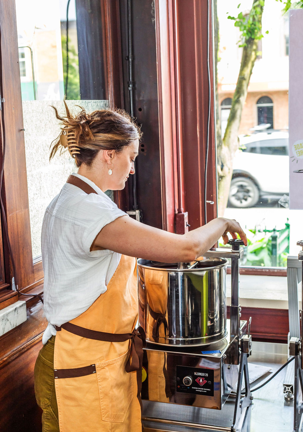 Elizabeth at the chocolate roaster in the Harvest Chocolate workshop
