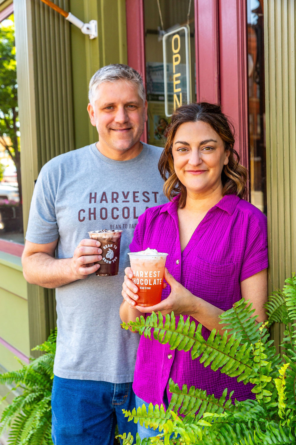 Matt and Elizabeth founders of Harvest Chocolate standing outside their bean-to-bar chocolate shop in Tecumseh Michigan